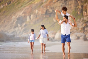 family walking beach