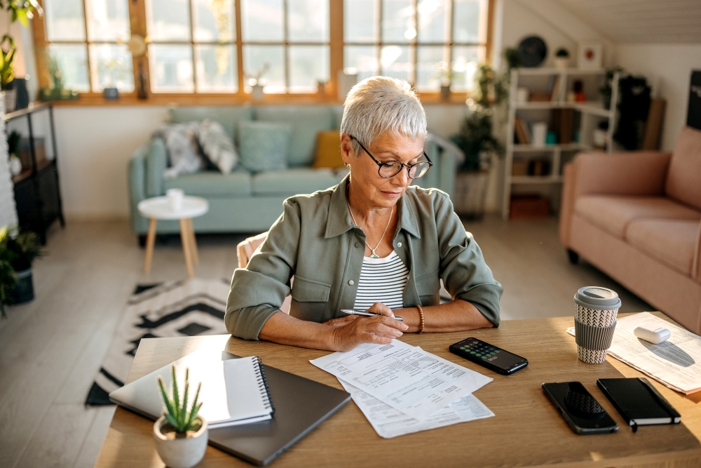 mature woman desk paperwork